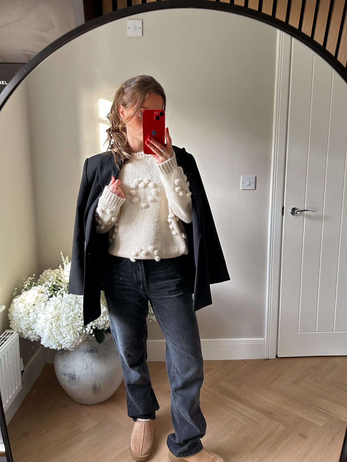 Cream casual jumper with heart shaped pom pom detailing.