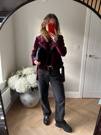 Velvet cropped bike jacket in burgundy with charcoal studded detailing on lapels.