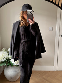 Women's black kniited matching lounge set.