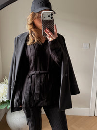 Black V neck longline jumper with tie waist and matching trousers.