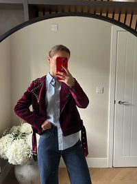 Burgundy velvet biker style jacket with zip cuffs and studded detailing.