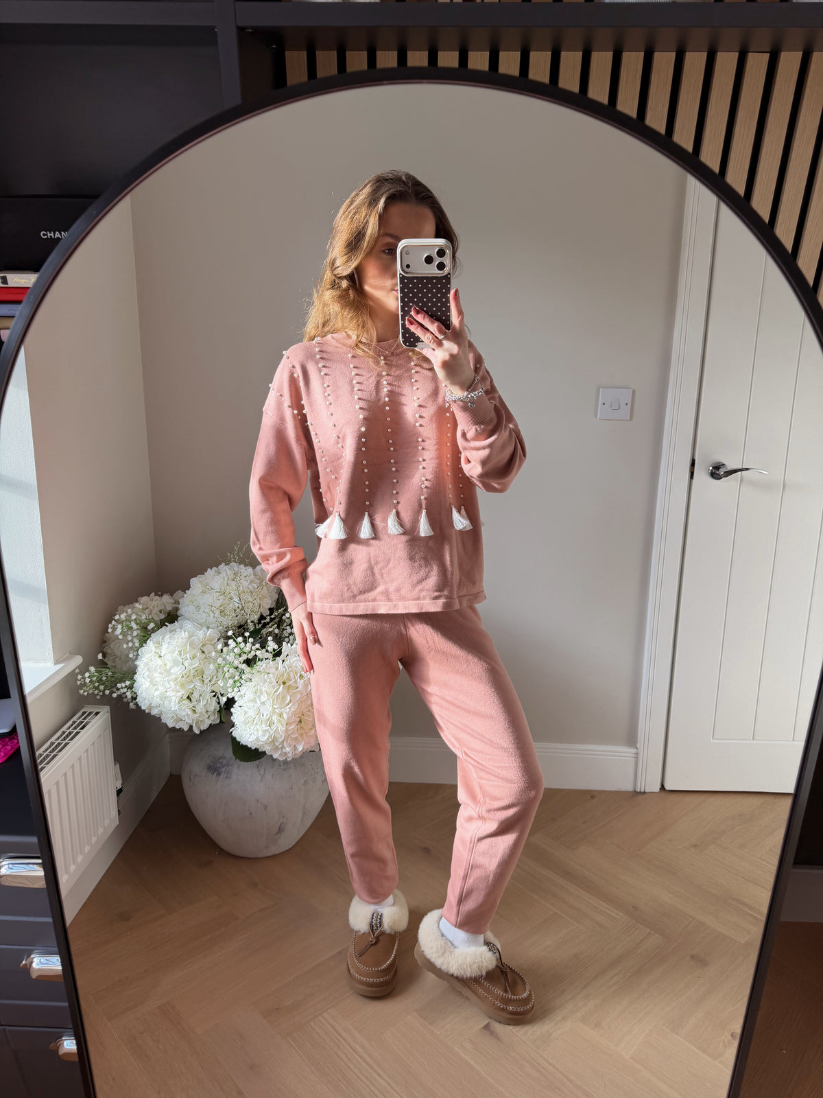 Womens soft pink loungewear matching set. Top features vertical lines of pearls with white tassel detailing at the end.