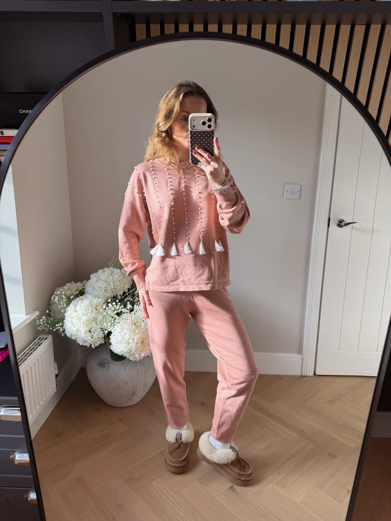 Womens soft pink loungewear matching set. Top features vertical lines of pearls with white tassel detailing at the end.