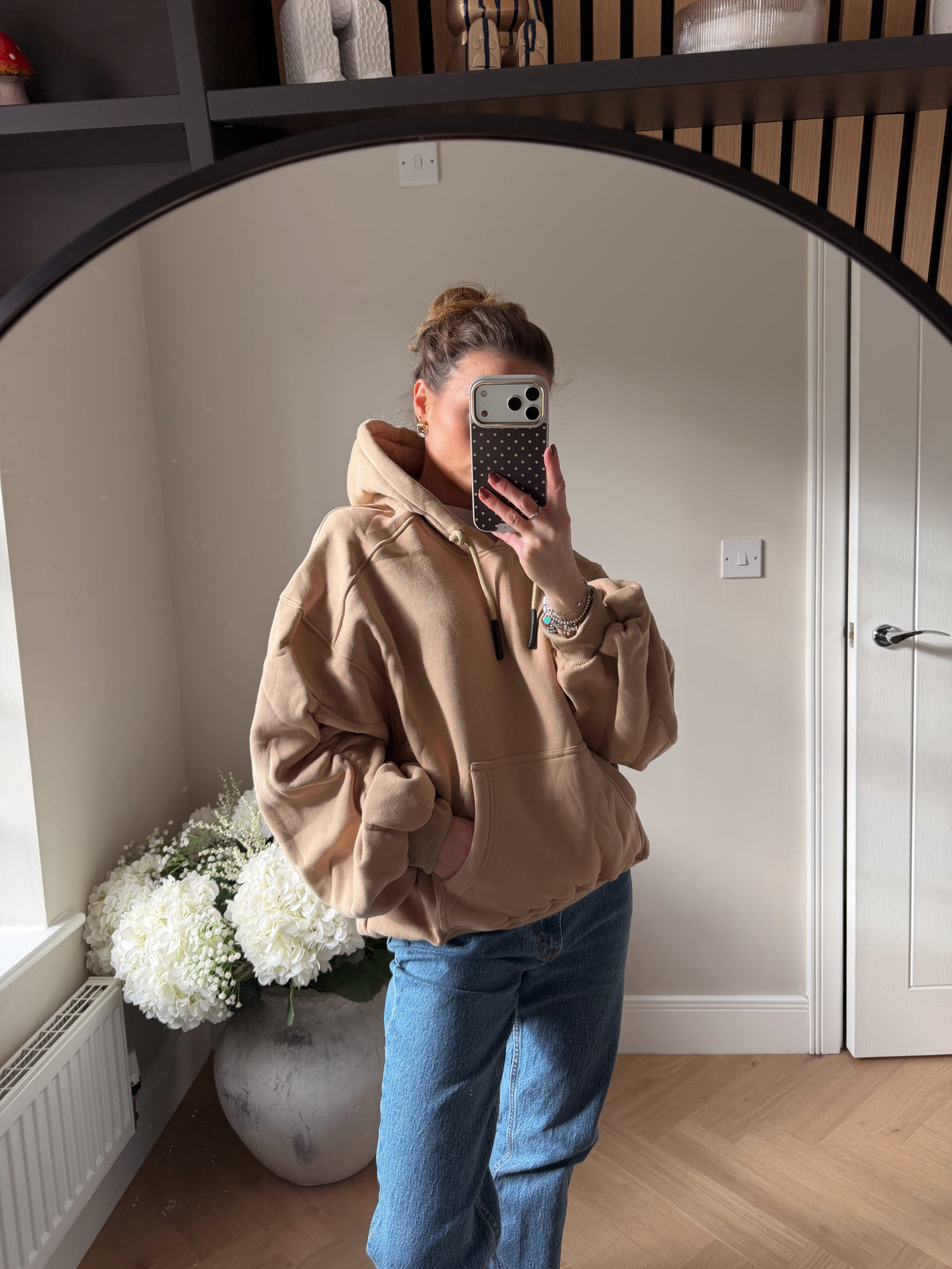 Oversized beige hoodie with oversized ruched sleeves.