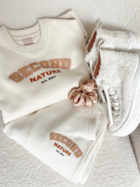 Oversized sweatshirt and jogger set in cream with brown printed Second Nature college style logo